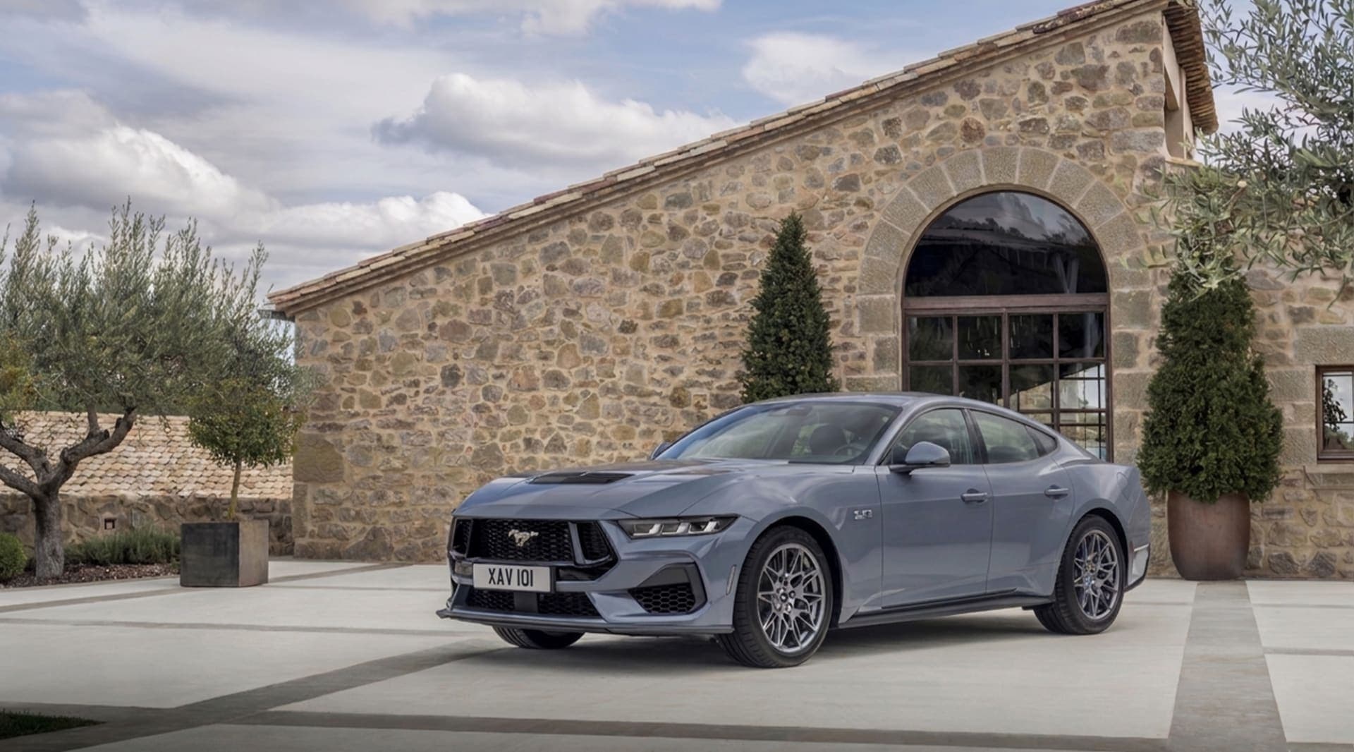 Ford showed dealers a four-door Mustang, and it reportedly keeps the V8 alive as a hybrid